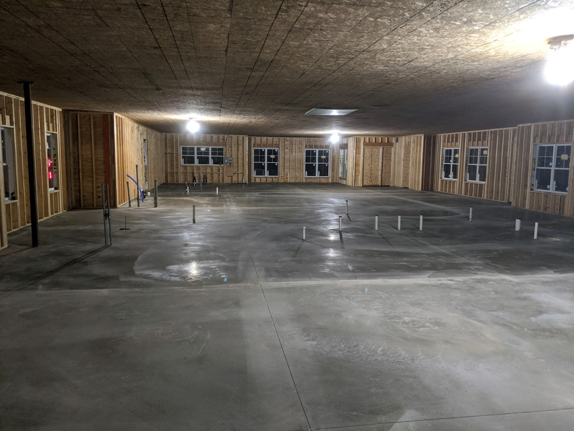 Concrete crew placing a wide interior slab