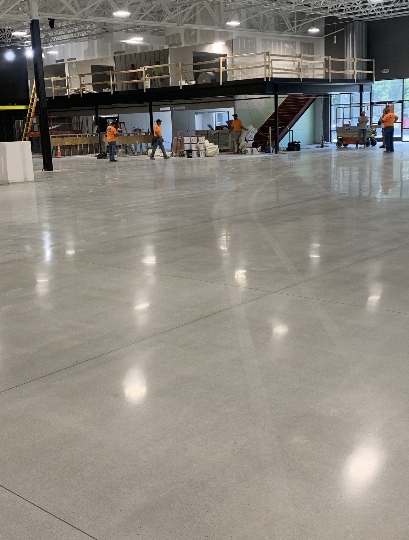 Commercial concrete work beneath a mezzanine